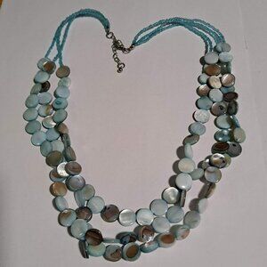 blue mother of pearl like necklace with beading and metal clasp
